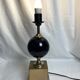 Vintage, metal base lamp with gold finish and black lacquer lampshade, circa 1970