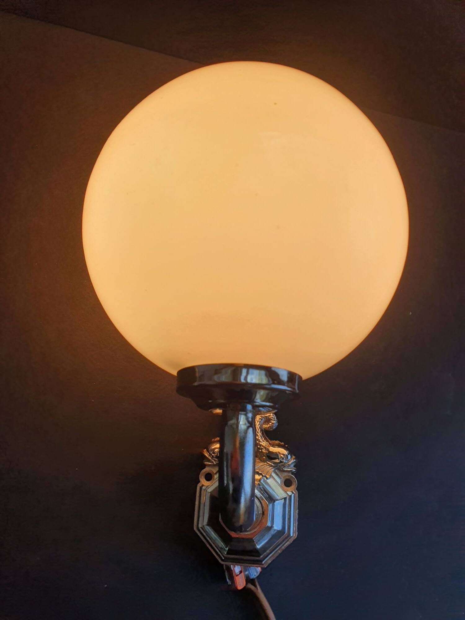 Pair of chrome wall sconces for bathroom with vintage fish pattern.