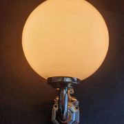 Pair of chrome wall sconces for bathroom with vintage fish pattern.