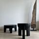 Black mango wood tripod side table with a semi-spherical top, height: 45 cm, diameter: 44 cm.