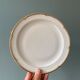 Series of 10 antique flat plates in Limoges porcelain