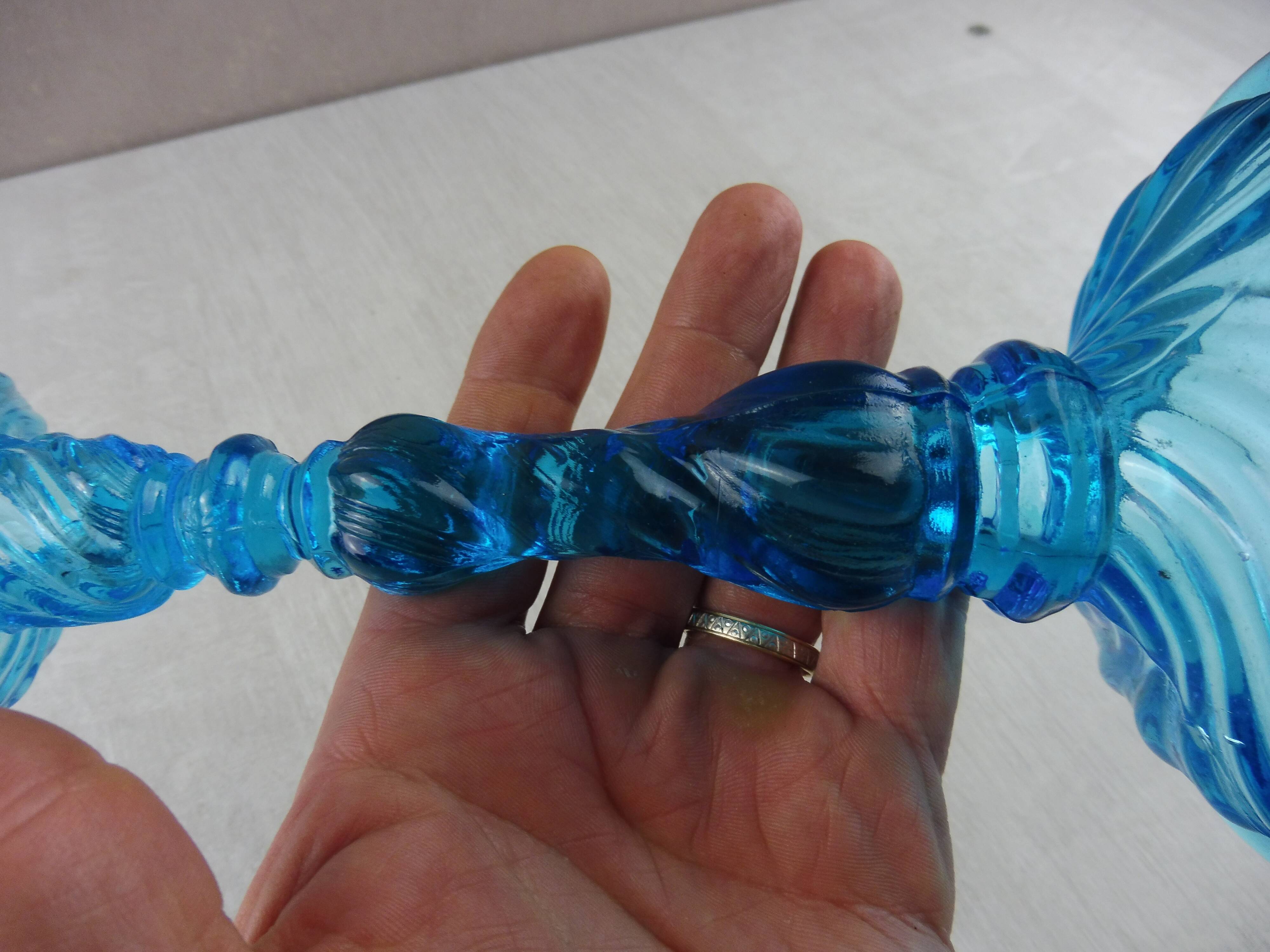 Old candlestick, blue molded glass