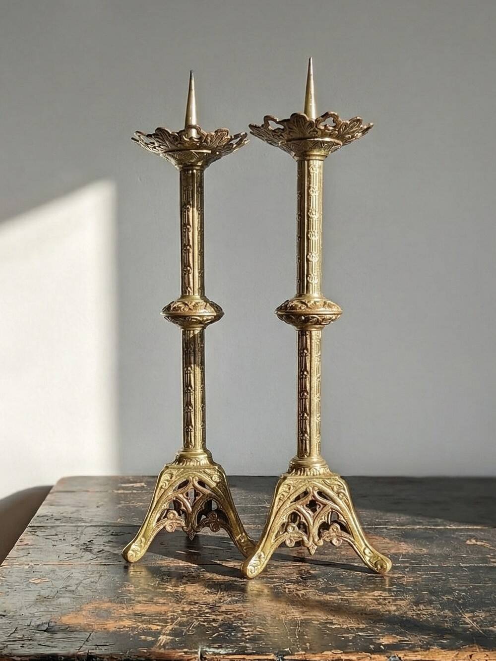 Large pair of antique gilded bronze candlesticks, Gothic style from the 19th century.