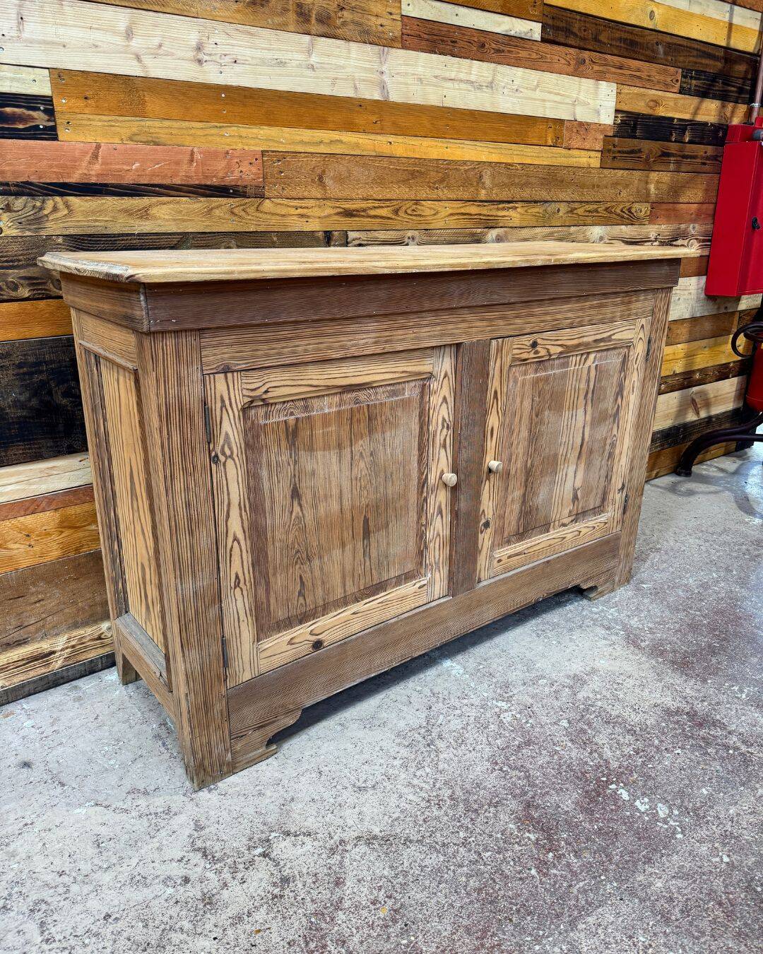 Old low sideboard in solid pitch pine