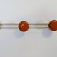Vintage orange triple coat hook — metal and lacquered discs from the 60s/70s