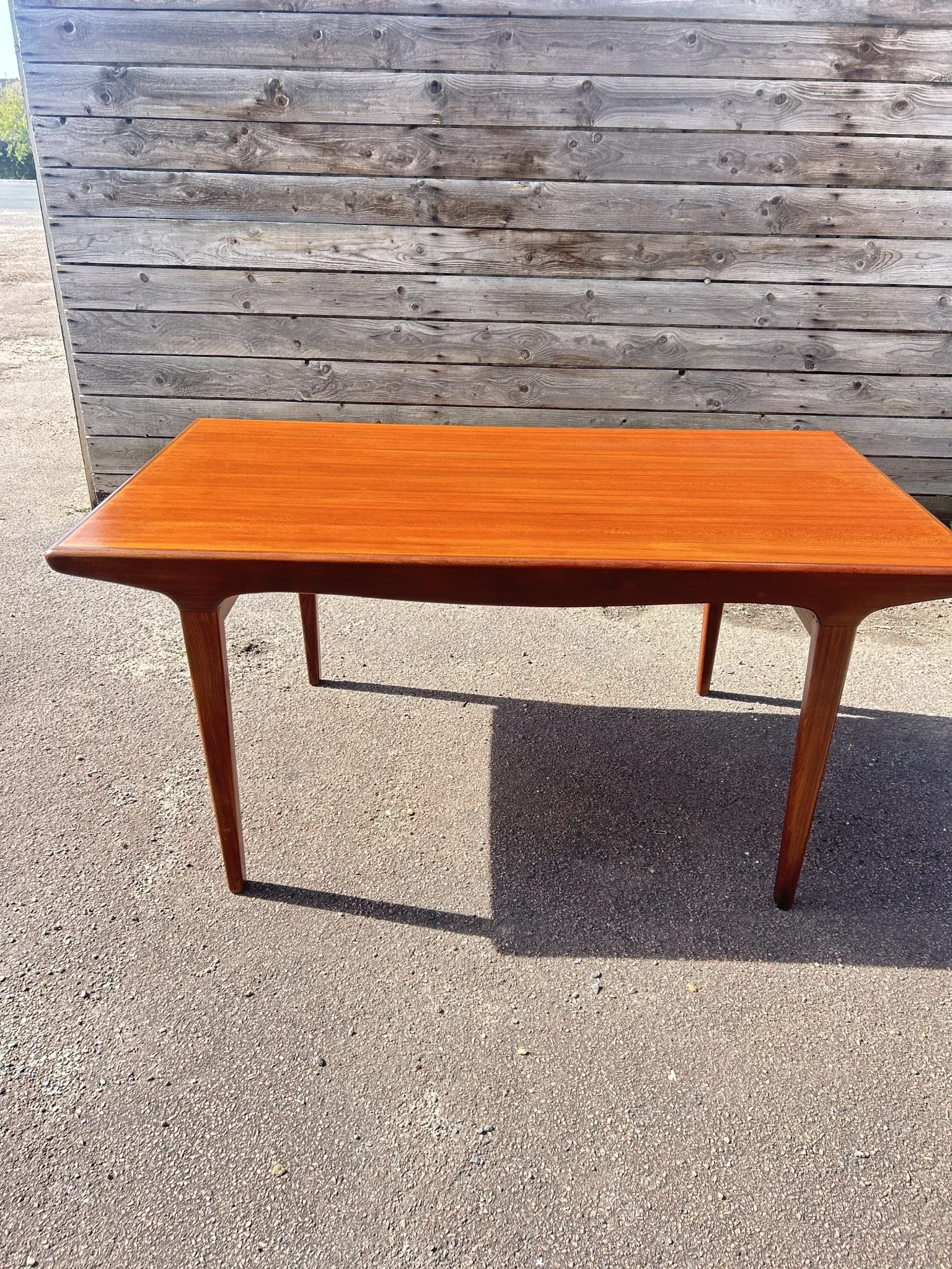 Rectangular extendable table in Scandinavian style made of teak.