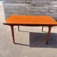 Rectangular extendable table in Scandinavian style made of teak.