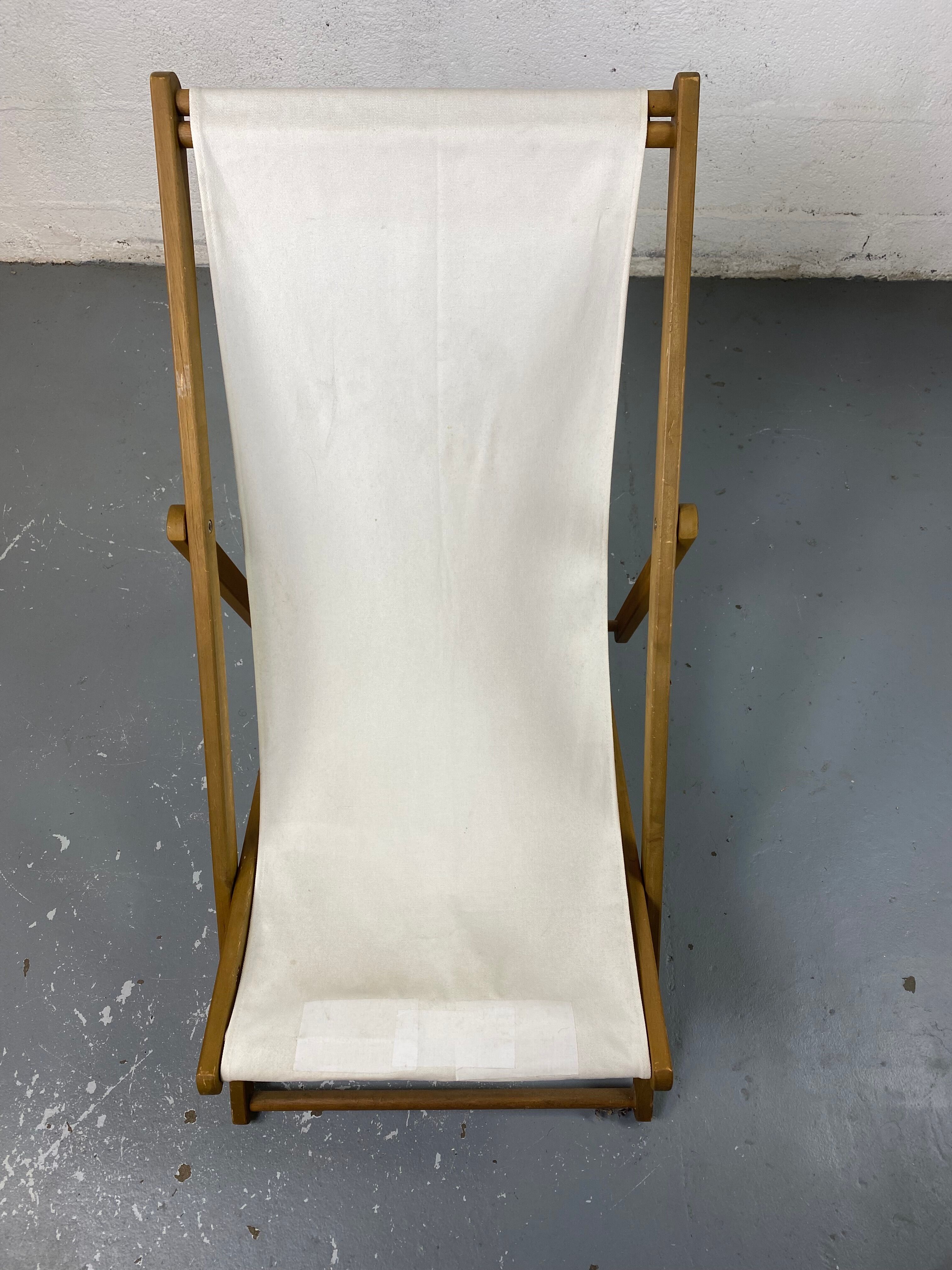 White fabric deckchair with wooden structure