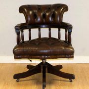 Restored Chesterfield captain's armchair in leather with an oak frame.