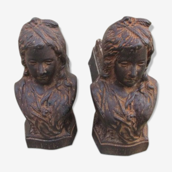 Pair of antique women's head cast iron chenets