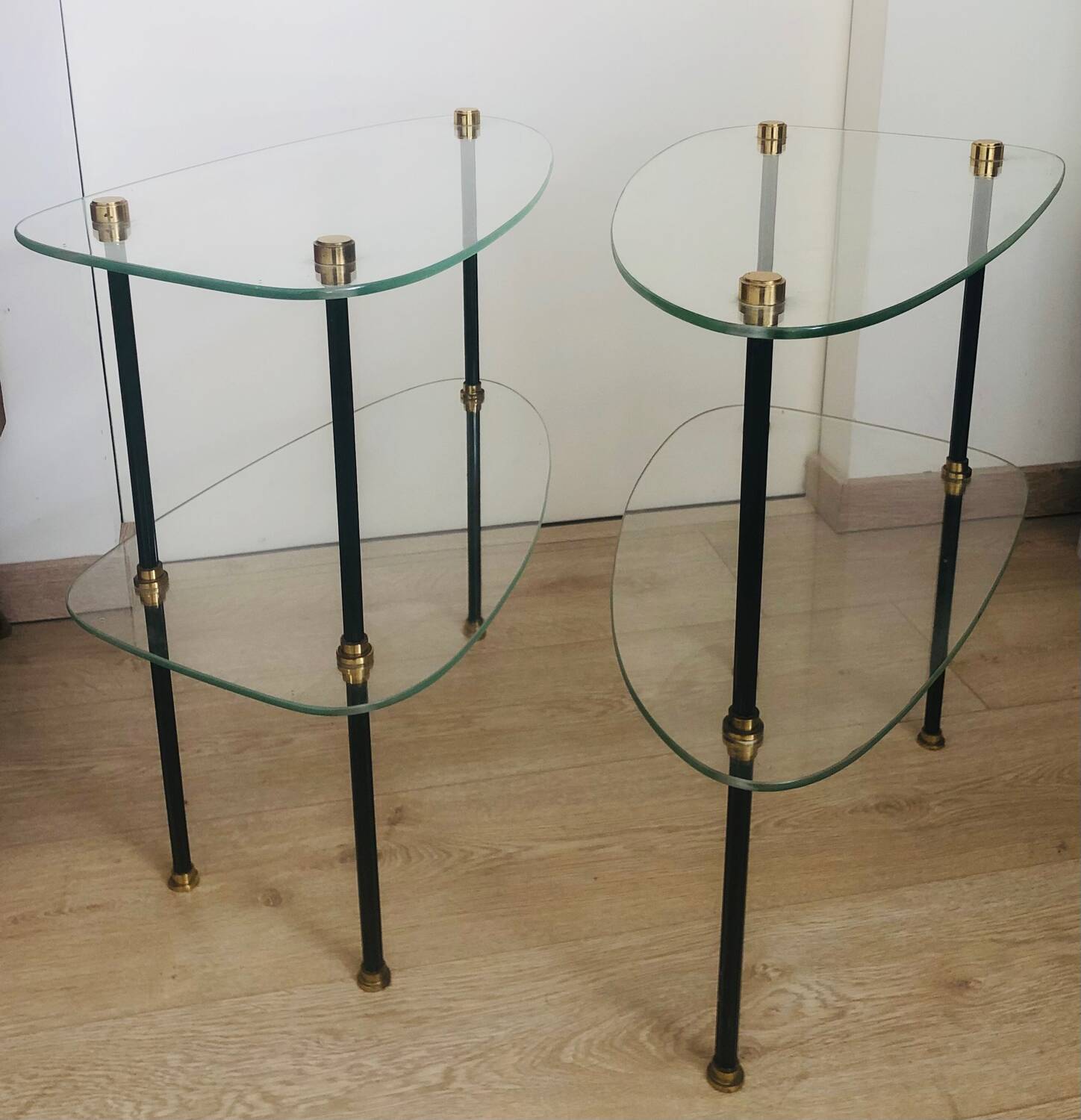 2 small side tables in glass and Bakelite with gold nuts from the 1960s.