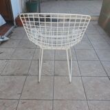 Chairs and footrest by Harry Bertoia