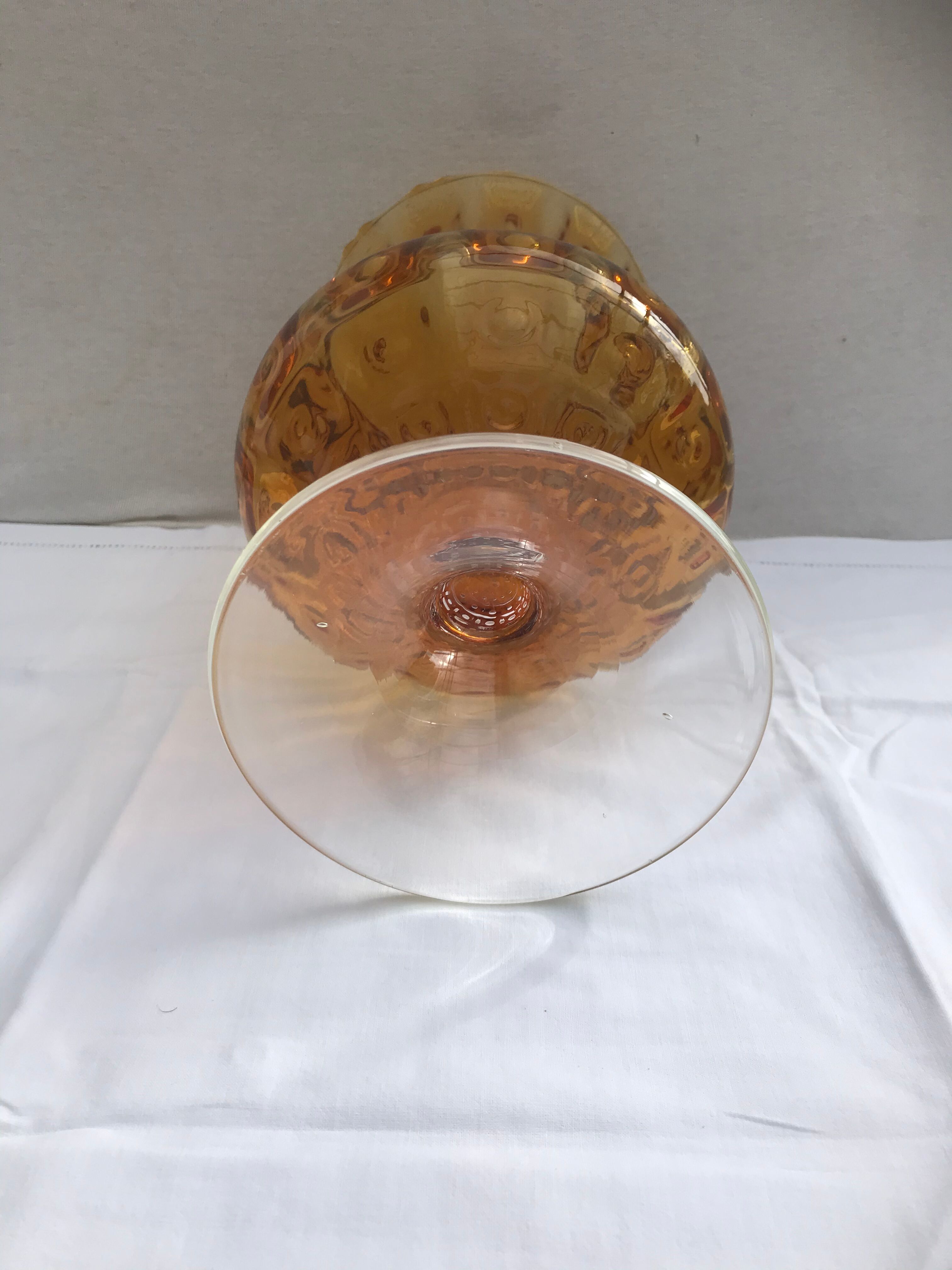 Ancient vase on foot orange glass
