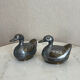 Pair of vintage decorative metal boxes in silver, shaped like ducks.