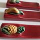 Suite de 6 porte-couteaux barbotine fruits