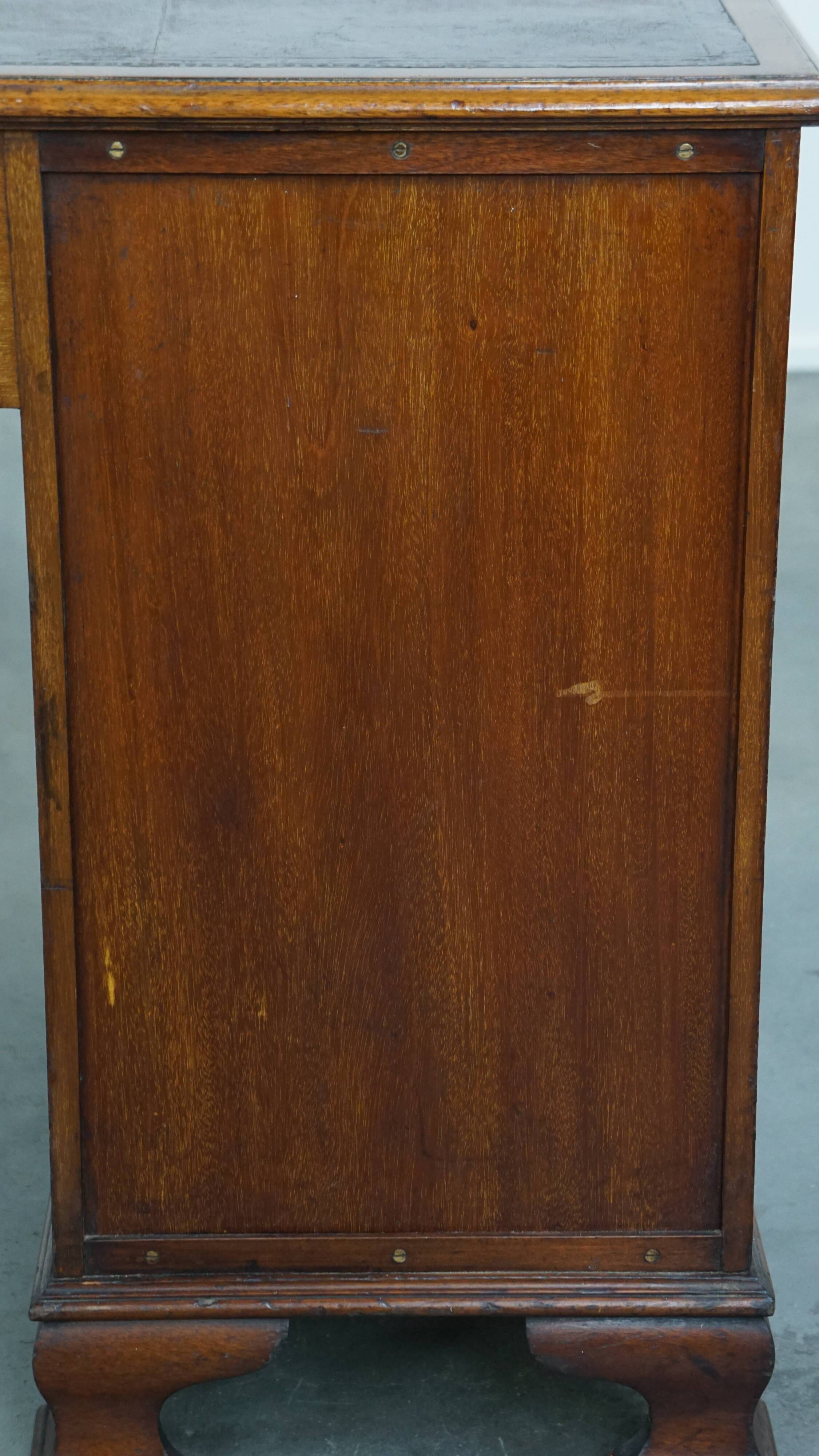 Antique wooden English desk from the late 19th century with a leather top