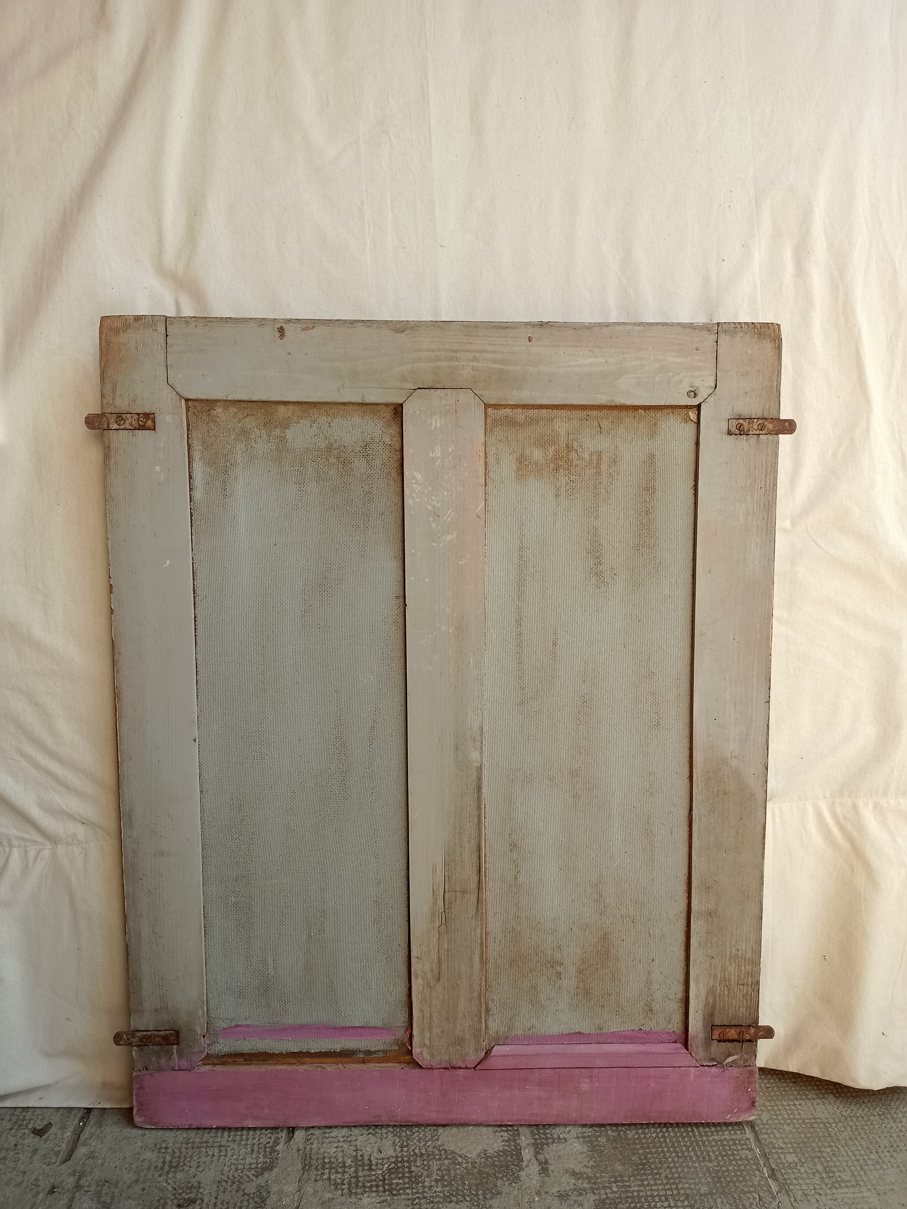 Old glazed door with its shutter