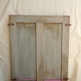 Old glazed door with its shutter