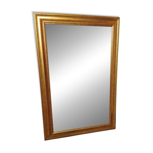 Miroir dans un élégant cadre doré. 84 x 57