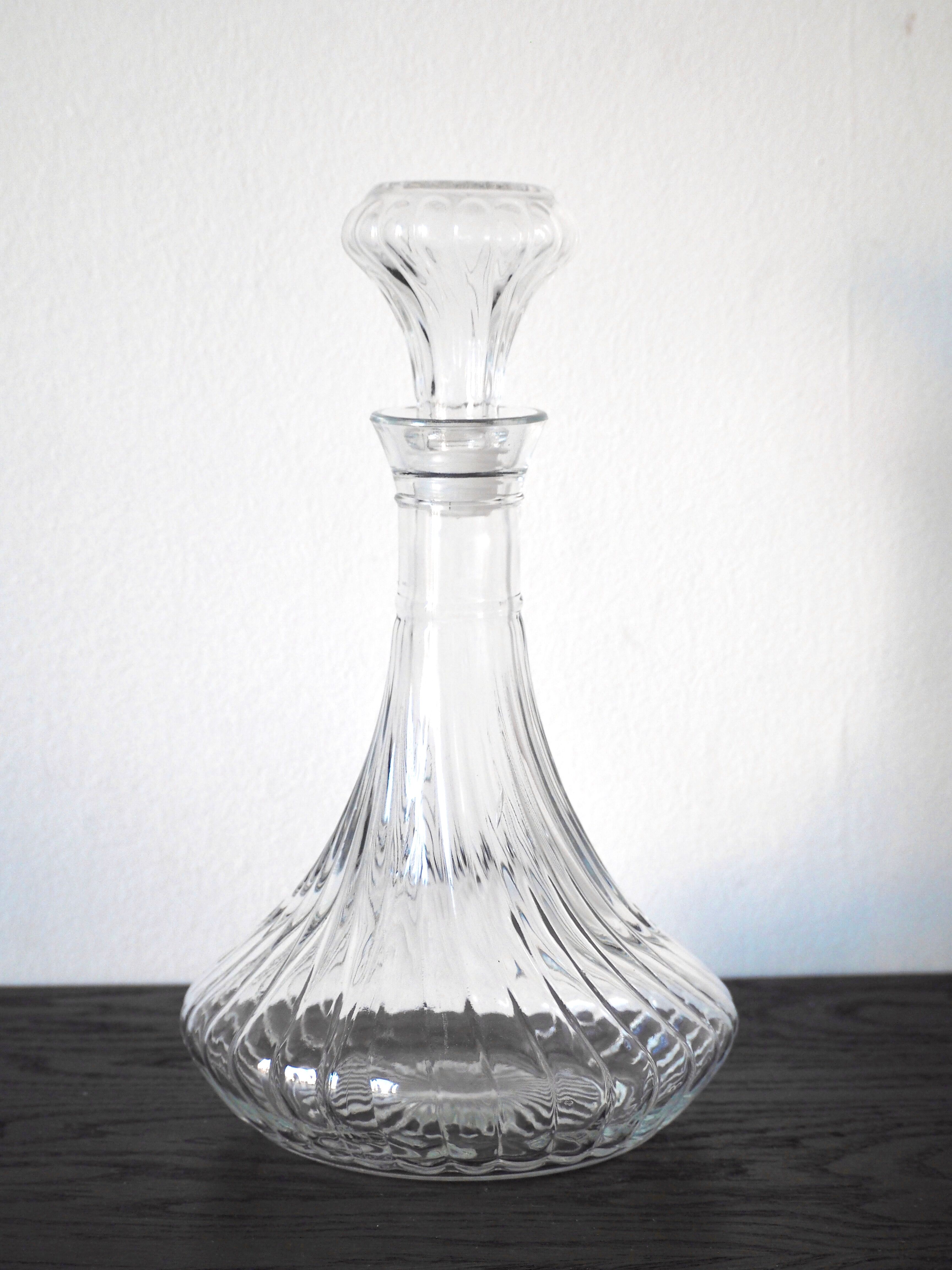 Scrolled glass wine decanter