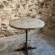 Bistro table / old garden with a cast iron base and stone top, France