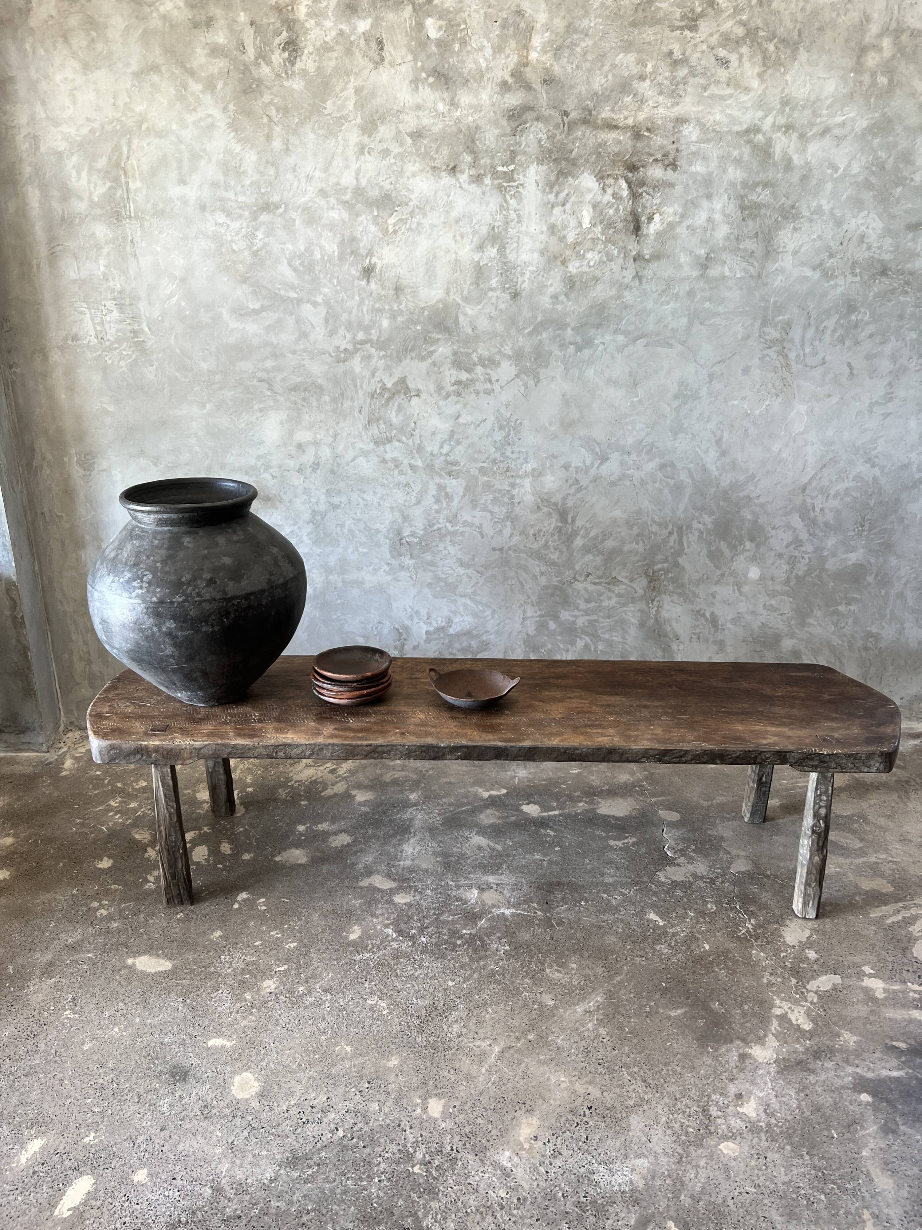 Large rounded coffee table in old Asian teak