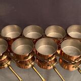 Suite of 12 tinned copper pans
