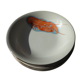Eight hollow plates decorated with lobsters