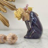 Frog carries bouquet