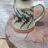 Hand-decorated and signed berry earthen pitcher