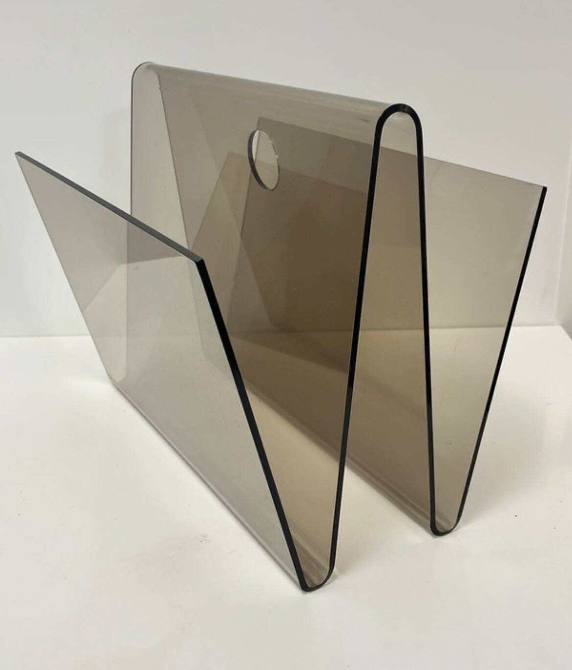Smoked plexiglass magazine rack in the style of Michel Dumas, France, 1970s.