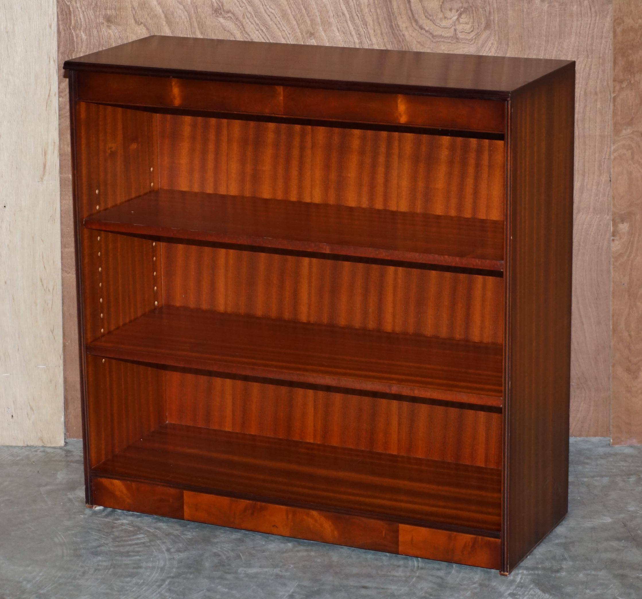 Pair of open low bookshelves Shaws of London in hardwood.
