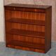 Pair of open low bookshelves Shaws of London in hardwood.