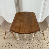 Extendable round table in raw and white wood
