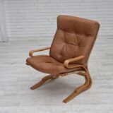 Fauteuil norvégien des années 1970, modèle "Kengu", cuir de meuble.