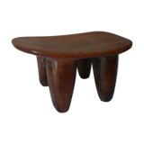 Tabouret where african head rests