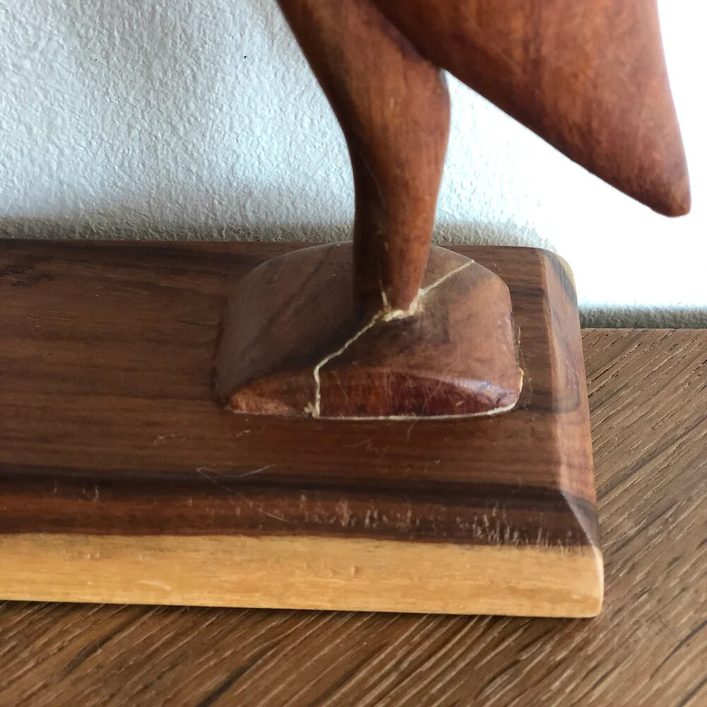 Sculpture of a goose feeding its young