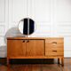 Vintage oak cabinet with circular mirror, 1960s modernist design.