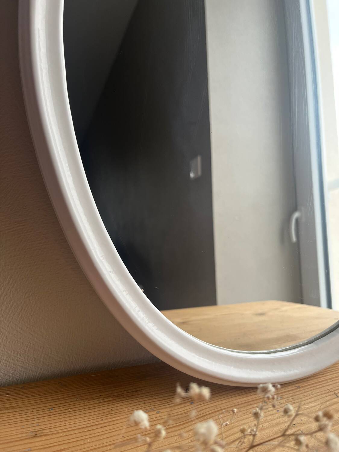 Vintage oval mirror in white enamelled cast iron
