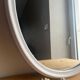 Vintage oval mirror in white enamelled cast iron