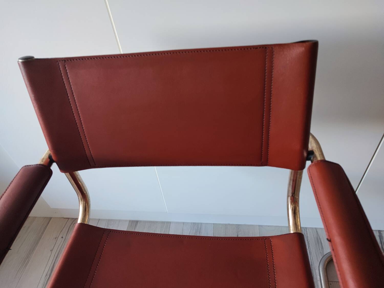 B34 armchairs, cognac leather and gilding