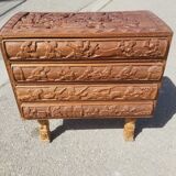 Compact 4-drawer ethnic chest of drawers carved with scenes of African life