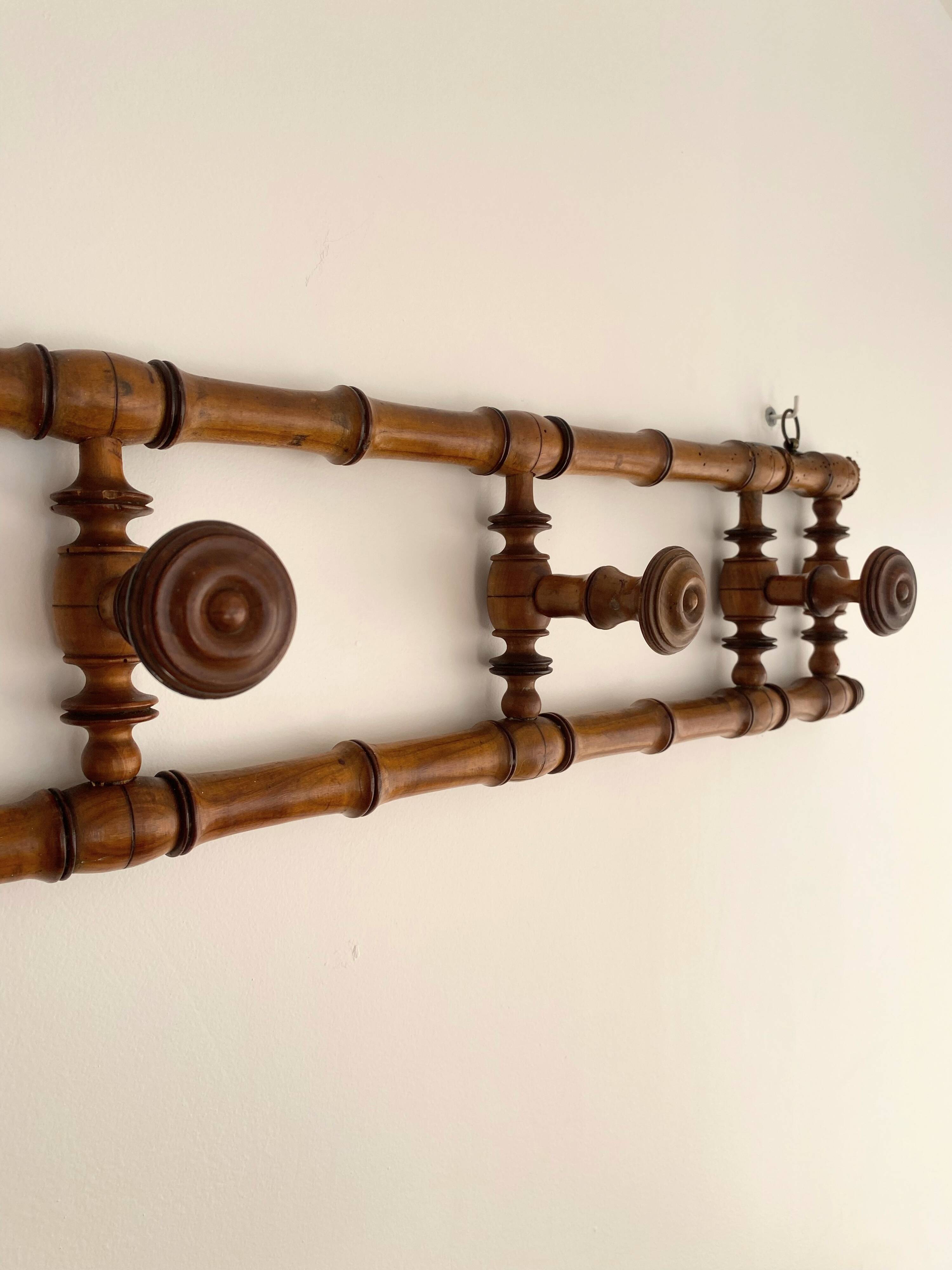 Vintage wooden wall coat rack with 4 swivel hooks from 1920