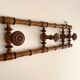 Vintage wooden wall coat rack with 4 swivel hooks from 1920