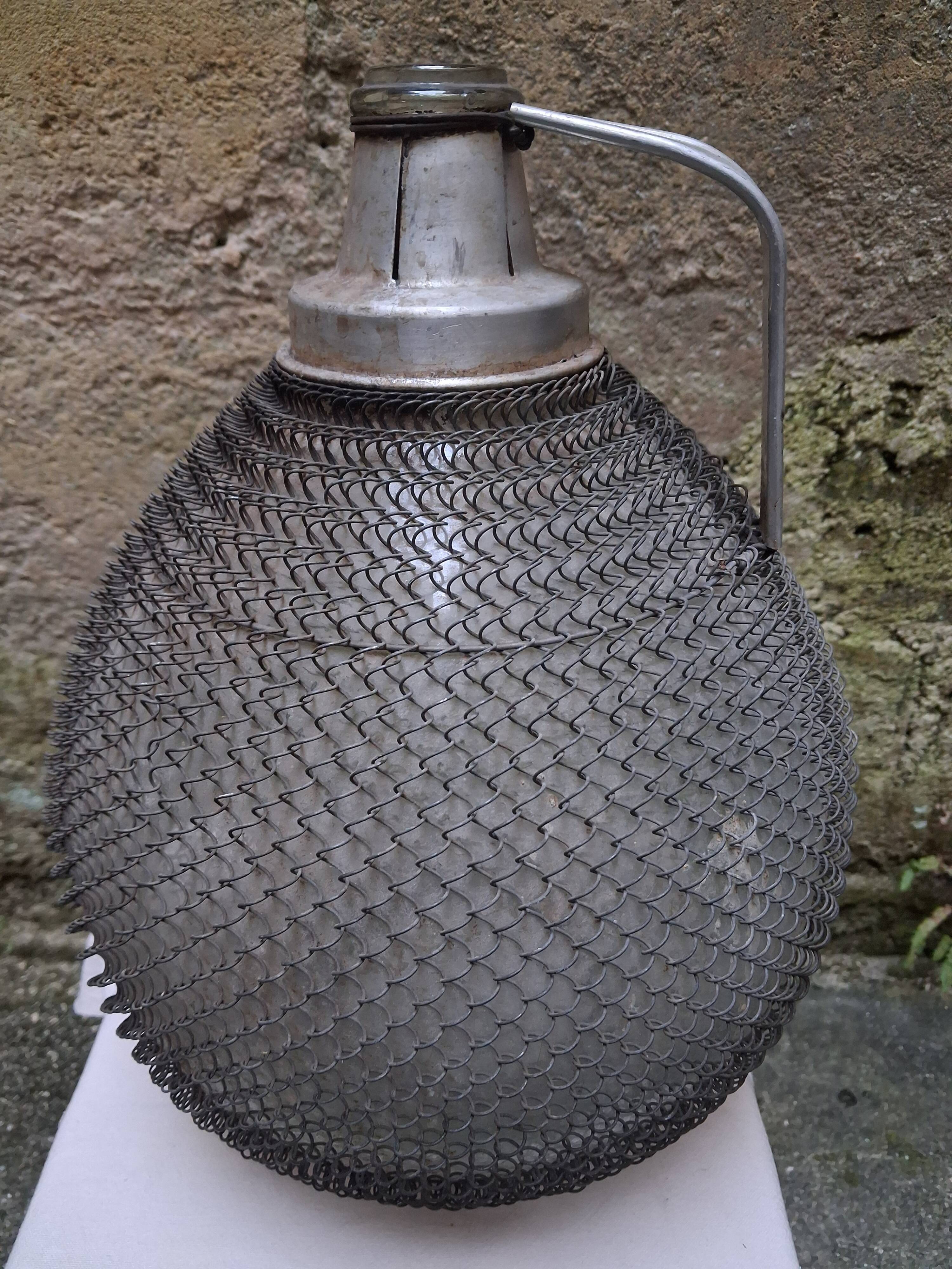 Demijohn, glass demijohn, with protective metal mesh, 1950-1960