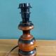 Turned wood bedside lamp with fabric lampshade