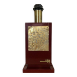 1980s vintage lamp base in red wood and gold metal.