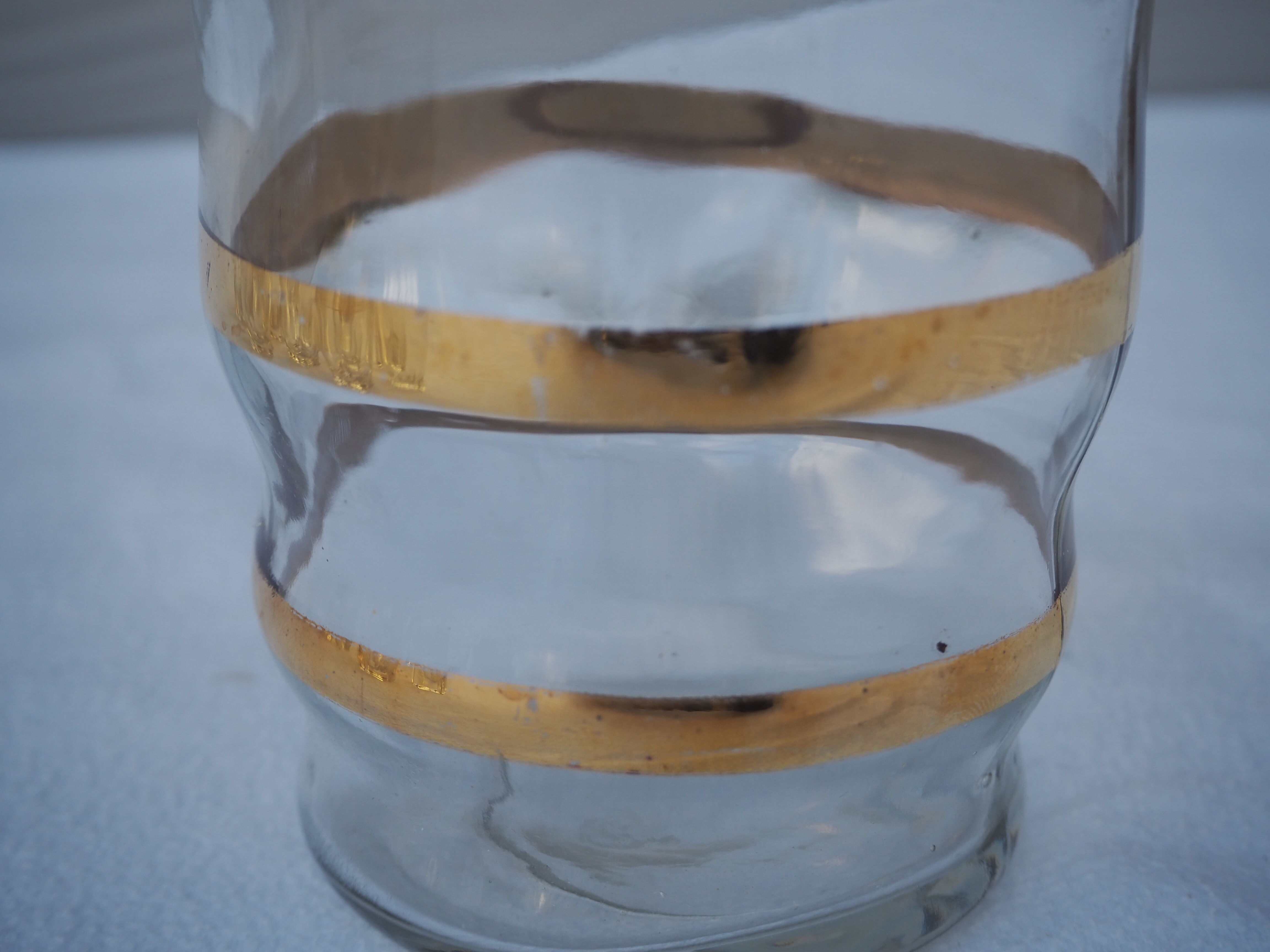 Golden liqueur service from the 1950s-1960s and its 12 glasses