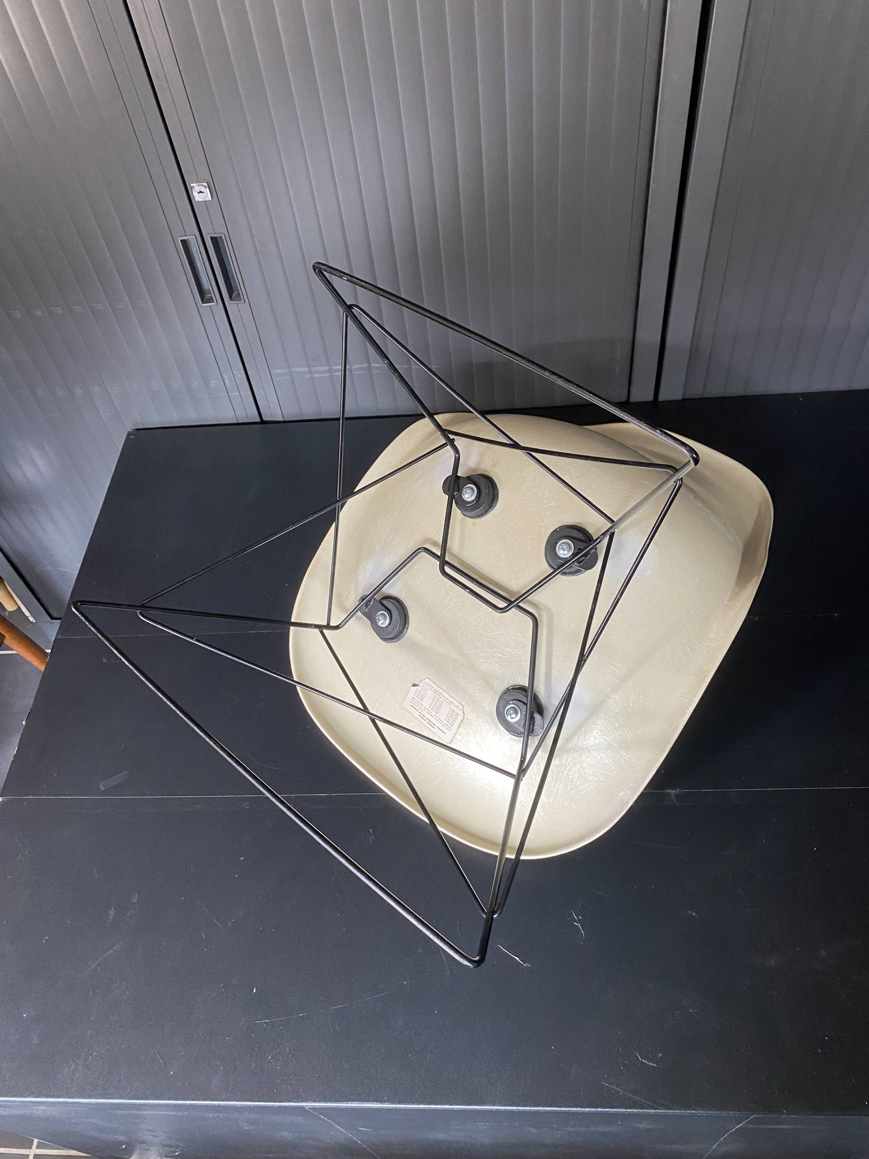 Eames lounge chair white fibre parchment base cat’s cradle Herman Miller