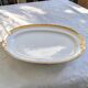 Large oval dish with gold trim in Limoges porcelain by Peconnet.